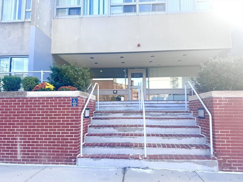 133 Park Street, Unit 404 Brookline, MA 02446 - Photo 21 of 25 a view of entryway with a front door