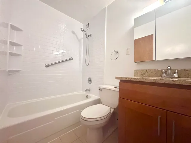 a bathroom with a sink a toilet and a bathtub