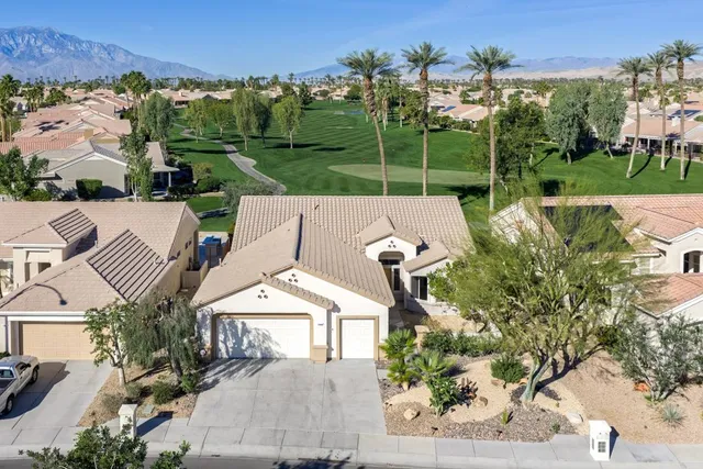 an aerial view of a house with a garden and plants