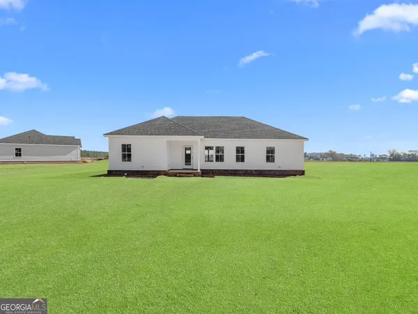 a view of a house with a big yard