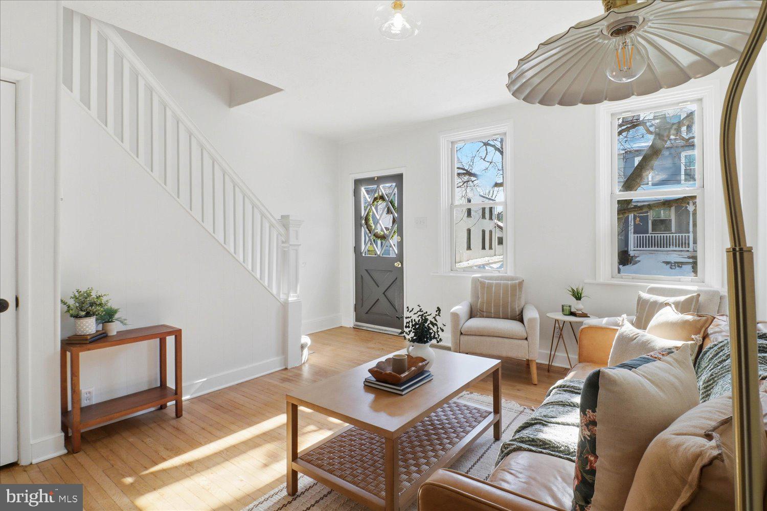 a living room with furniture and a dining table