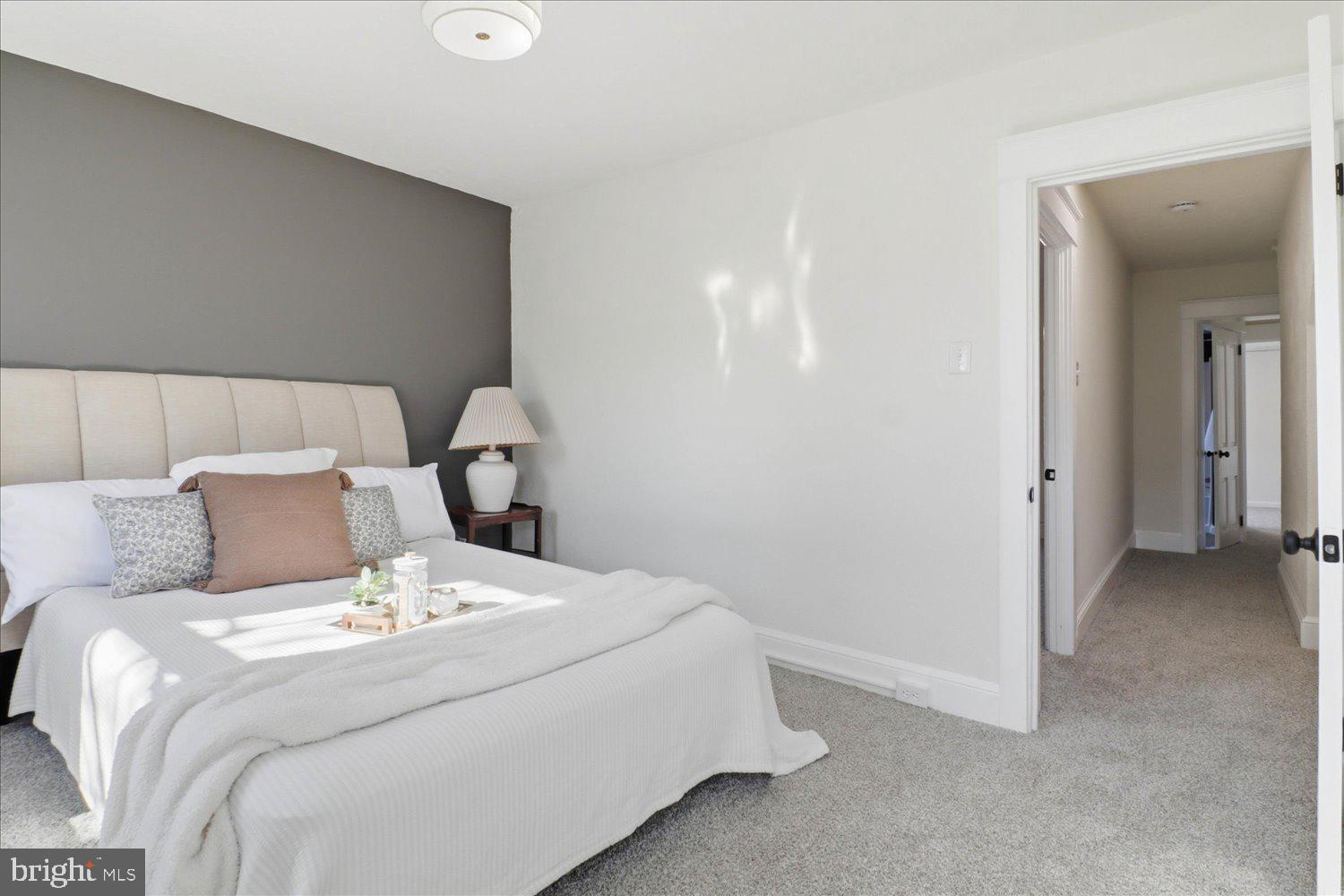 27 West New Street Lancaster, PA 17603 - Photo 14 of 29 a bed sitting in a bedroom and lamp