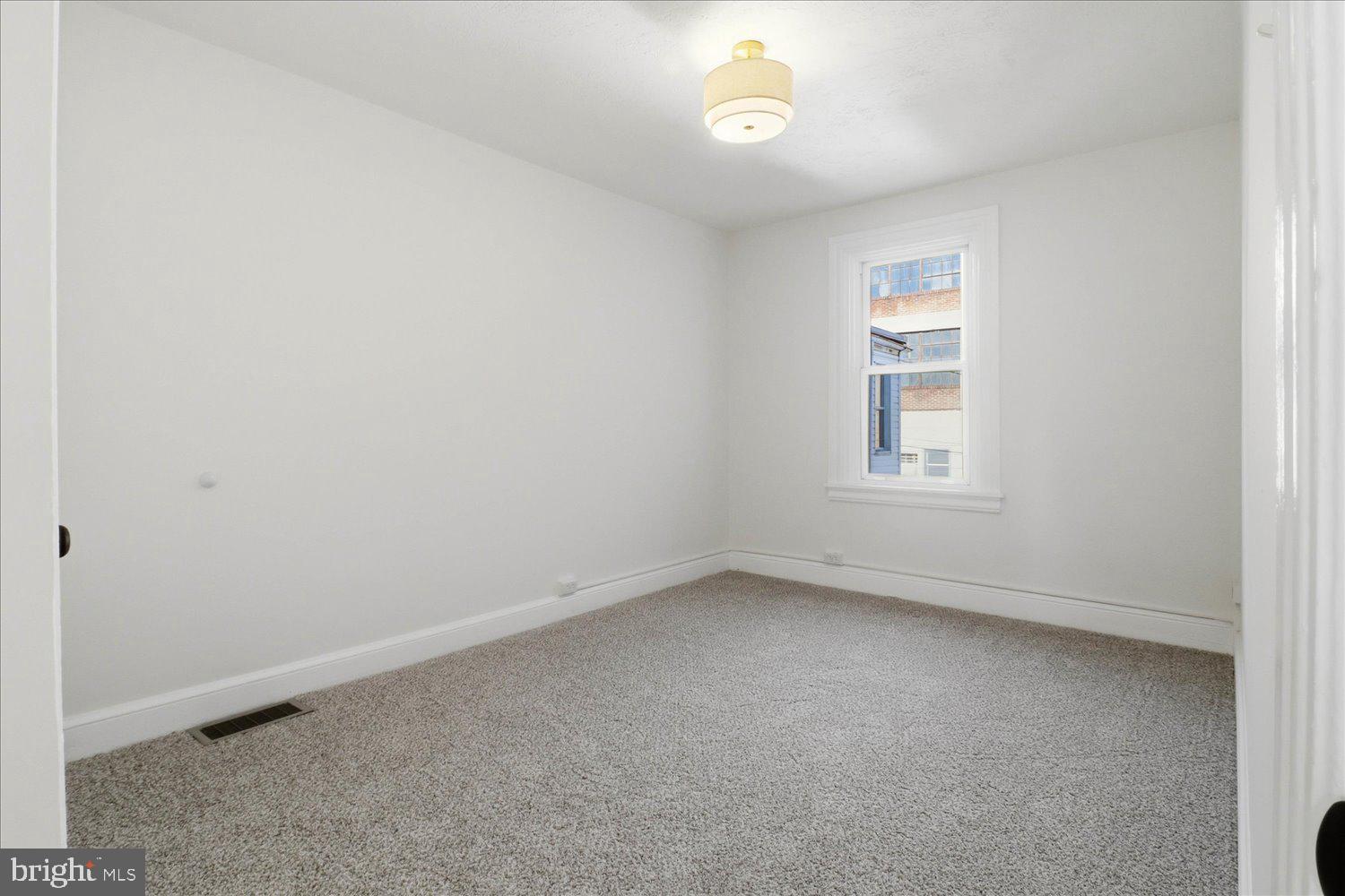 27 West New Street Lancaster, PA 17603 - Photo 15 of 29 an empty room with a window