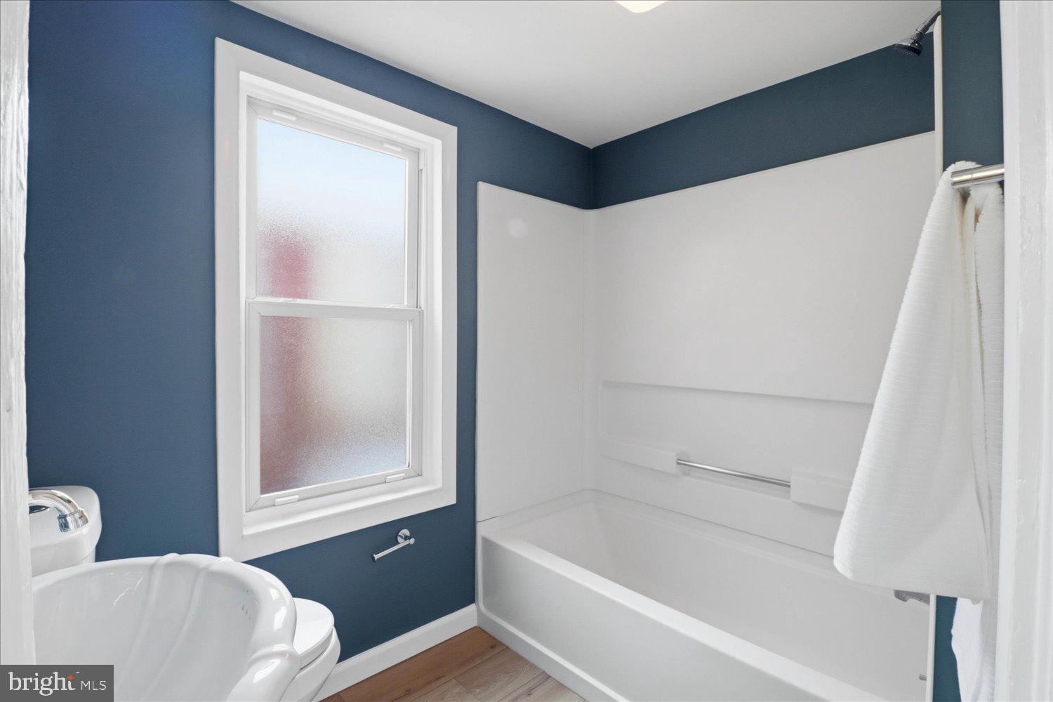 27 West New Street Lancaster, PA 17603 - Photo 10 of 29 a bathroom with a bathtub and a shower