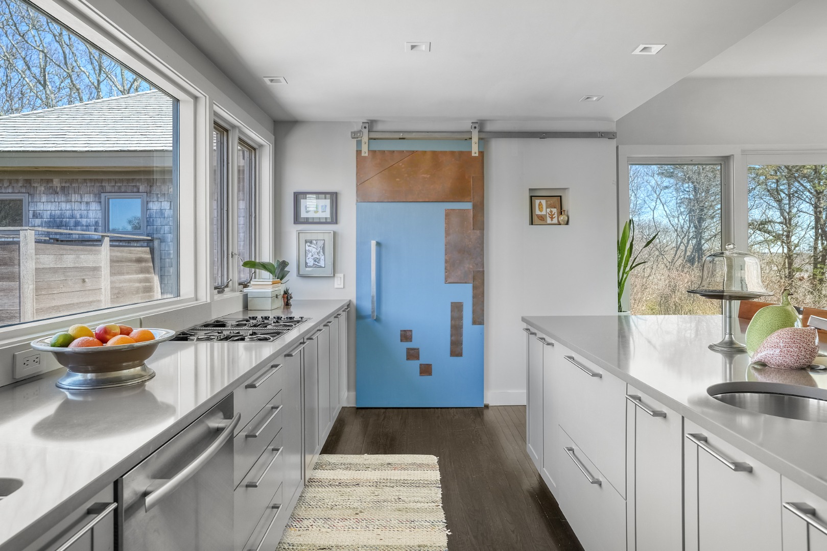 12 East Pasture Road Aquinnah, MA 02535 - Photo 12 of 24 Decorative barn door conceals a generous pantry space.