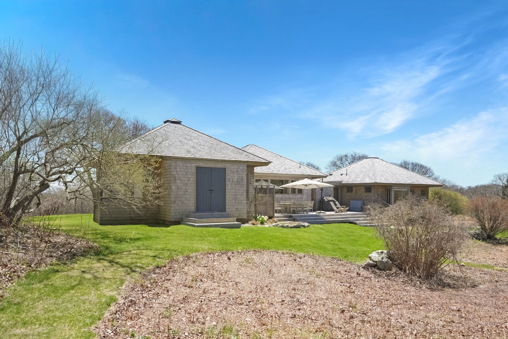 12 East Pasture Road Aquinnah, MA 02535 - Photo 20 of 24 The back of the house has a large deck, storage and an outdoor shower.