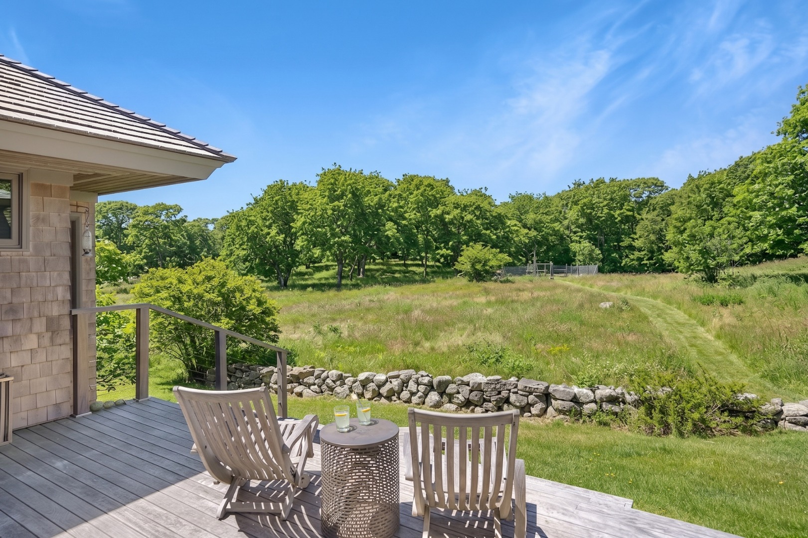 12 East Pasture Road Aquinnah, MA 02535 - Photo 21 of 24 Enjoy your morning coffee or evening cocktails from the back deck looking out over the meadow.