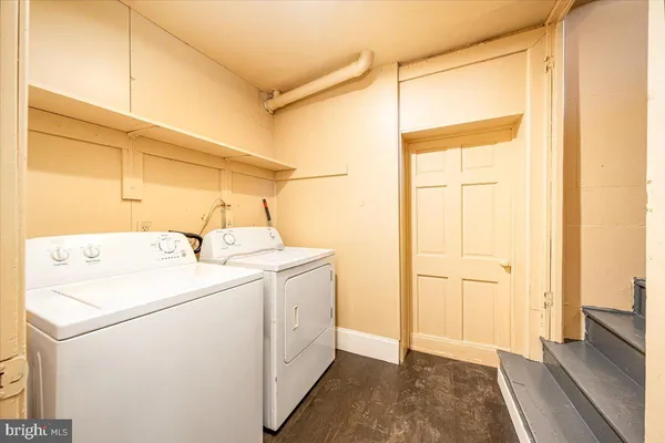 a bathroom with a toilet a sink and a mirror