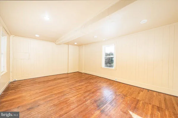 a view of a kitchen with wooden floor