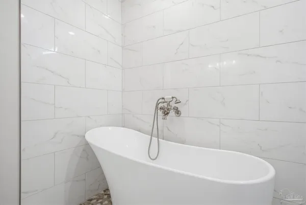 a bathroom with 2 sink and a mirror