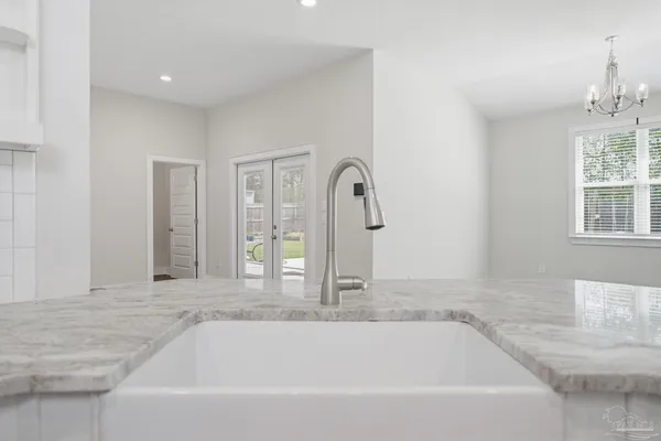 a bathroom with bathtub and window