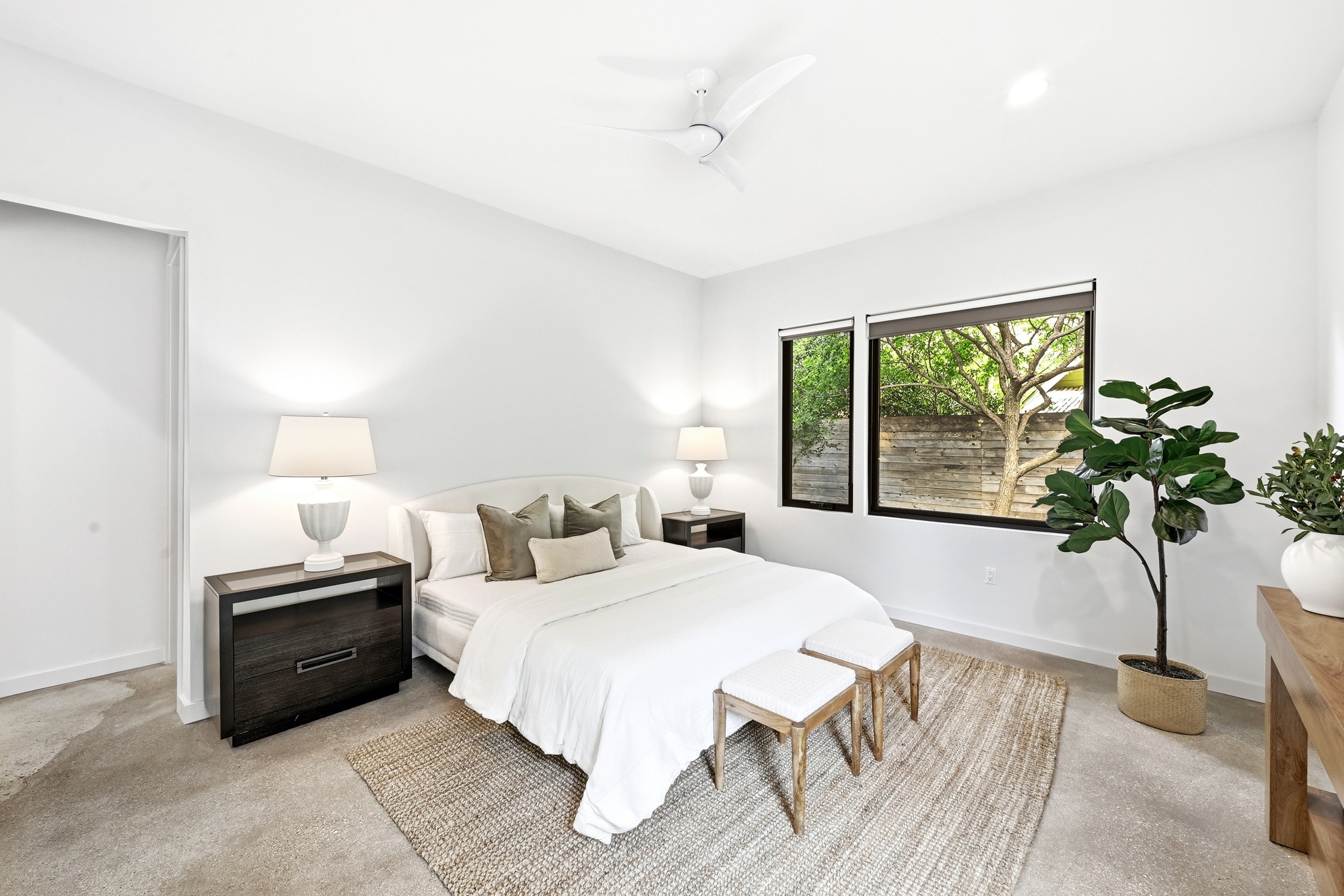 1609 Bauerle Avenue Austin, TX 78704 - Photo 11 of 34 Serene Primary Suite overlooks lush fern garden at the back of the property
