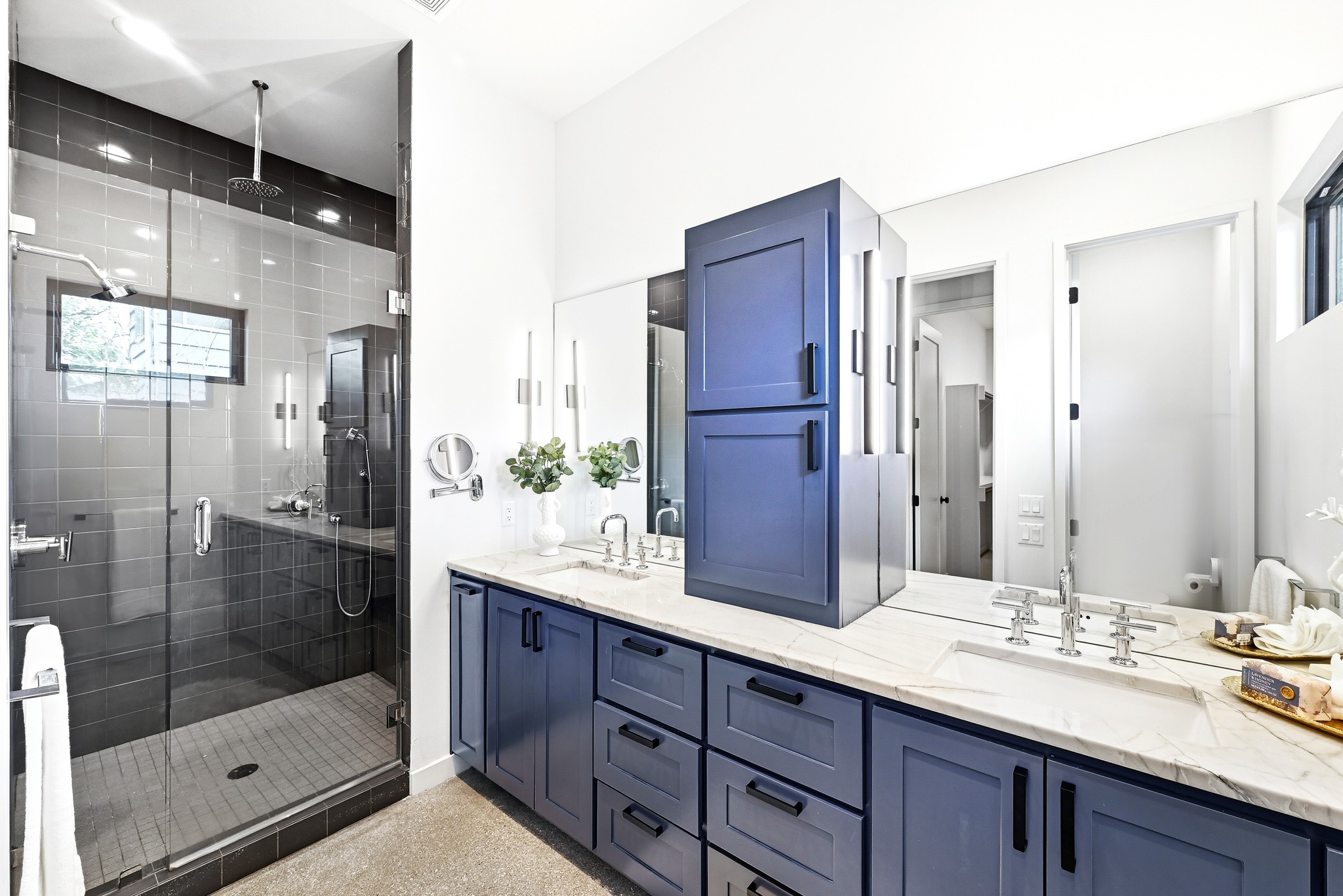 1609 Bauerle Avenue Austin, TX 78704 - Photo 13 of 34 Spacious Primary Bath with walk-in shower, a rain shower head, dual sinks and custom cabinetry