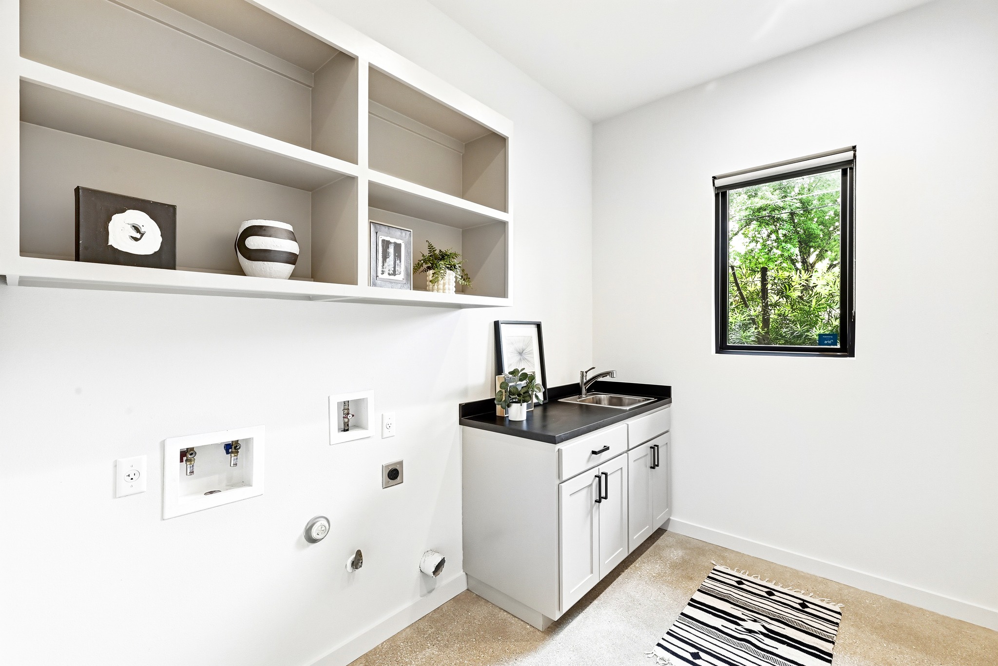 1609 Bauerle Avenue Austin, TX 78704 - Photo 23 of 34 Large main floor laundry room with built ins