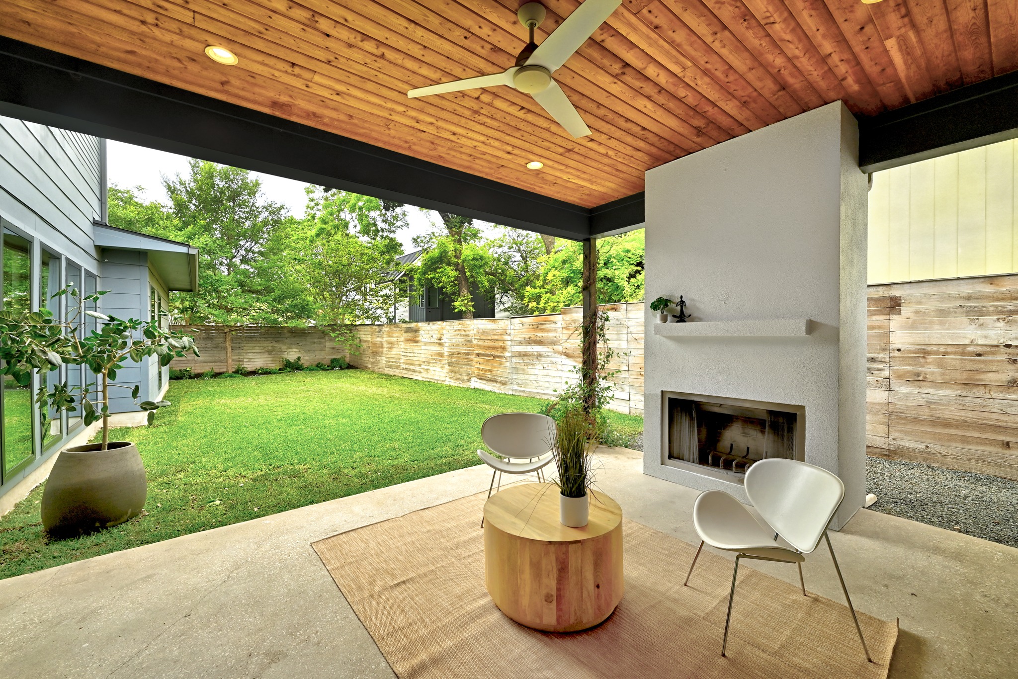 1609 Bauerle Avenue Austin, TX 78704 - Photo 25 of 34 Year round delight on this covered patio with wood burning fireplace and ceiling fan