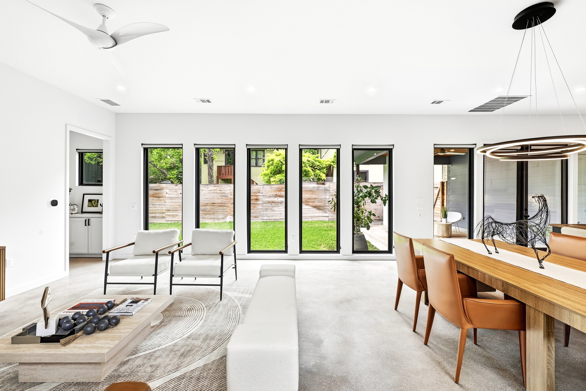 1609 Bauerle Avenue Austin, TX 78704 - Photo 4 of 34 Looking through the wall of windows and French doors toward the side lawn and covered patio