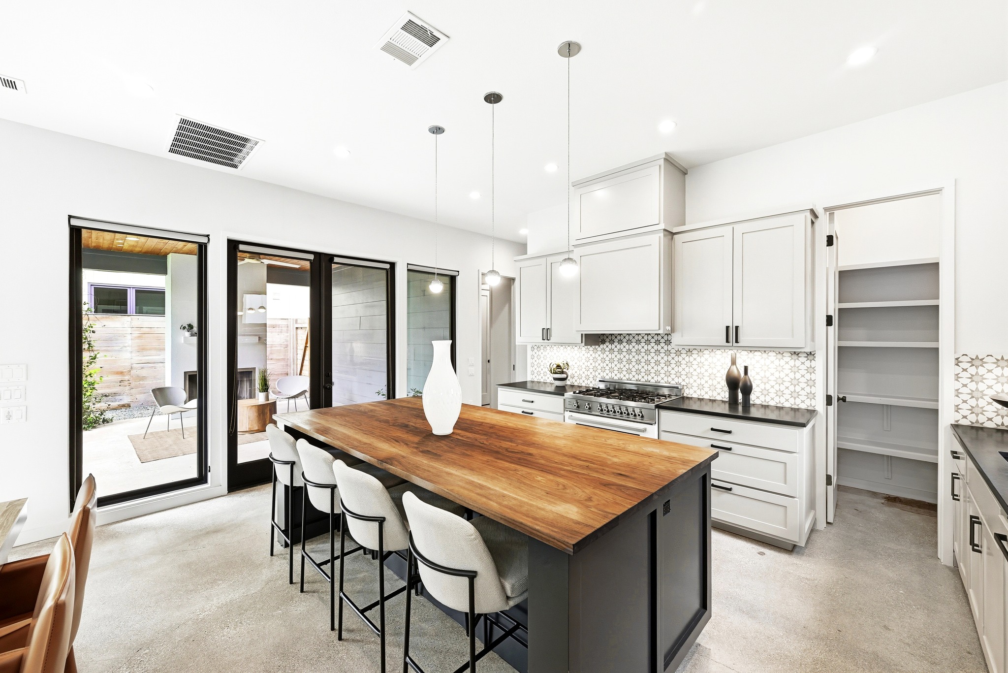 1609 Bauerle Avenue Austin, TX 78704 - Photo 5 of 34 View from Breakfast bar out to the covered patio/ large Kitchen pantry