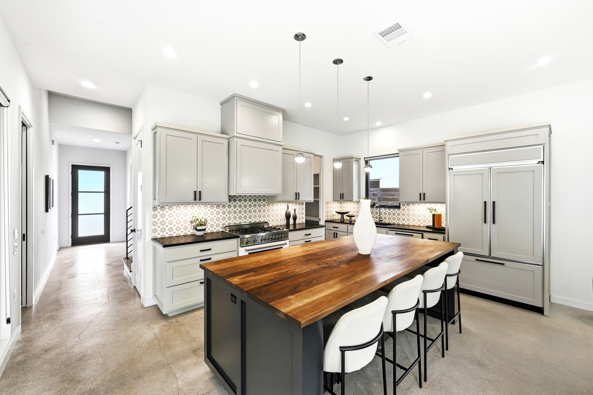 1609 Bauerle Avenue Austin, TX 78704 - Photo 6 of 34 Custom Cabinetry and Rich Walnut Island / Breakfast Bar that seats 4