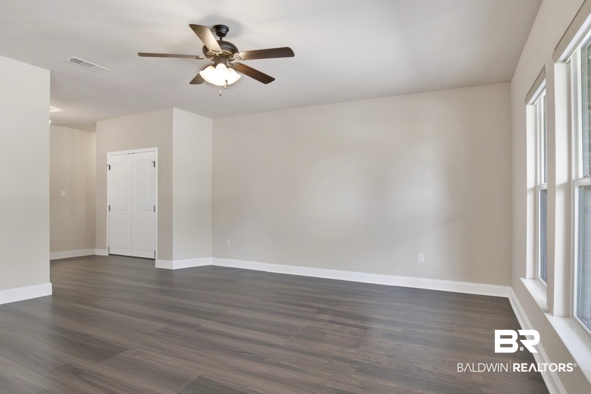 21282 Merlot Loop Silverhill, AL 36576 - Photo 10 of 27 Spare room featuring dark hardwood / wood-style flooring and ceiling fan
