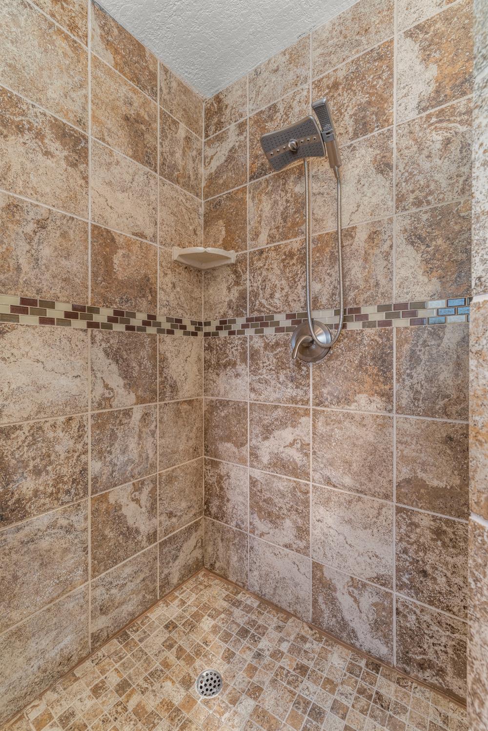 24126 Green Valley Road Auburn, CA 95602 - Photo 15 of 65 a bathroom with a shower