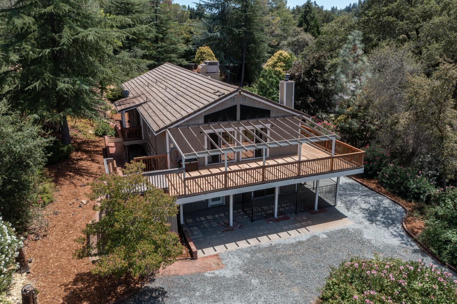 24126 Green Valley Road Auburn, CA 95602 - Photo 23 of 65 an aerial view of a house with a yard table and chairs