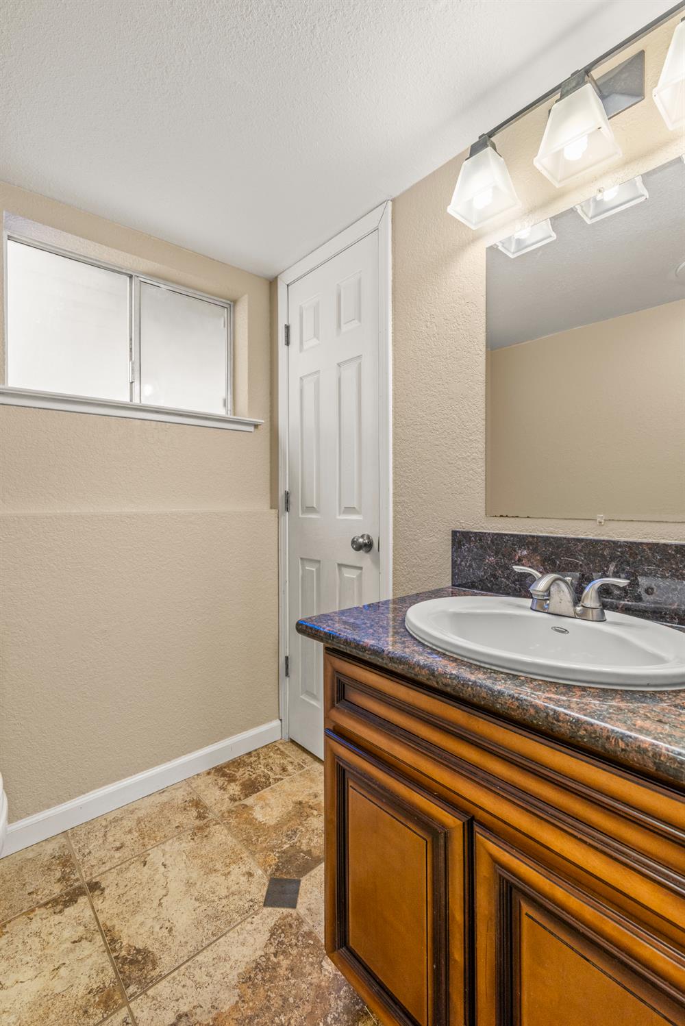 24126 Green Valley Road Auburn, CA 95602 - Photo 41 of 65 a bathroom with a sink and a mirror