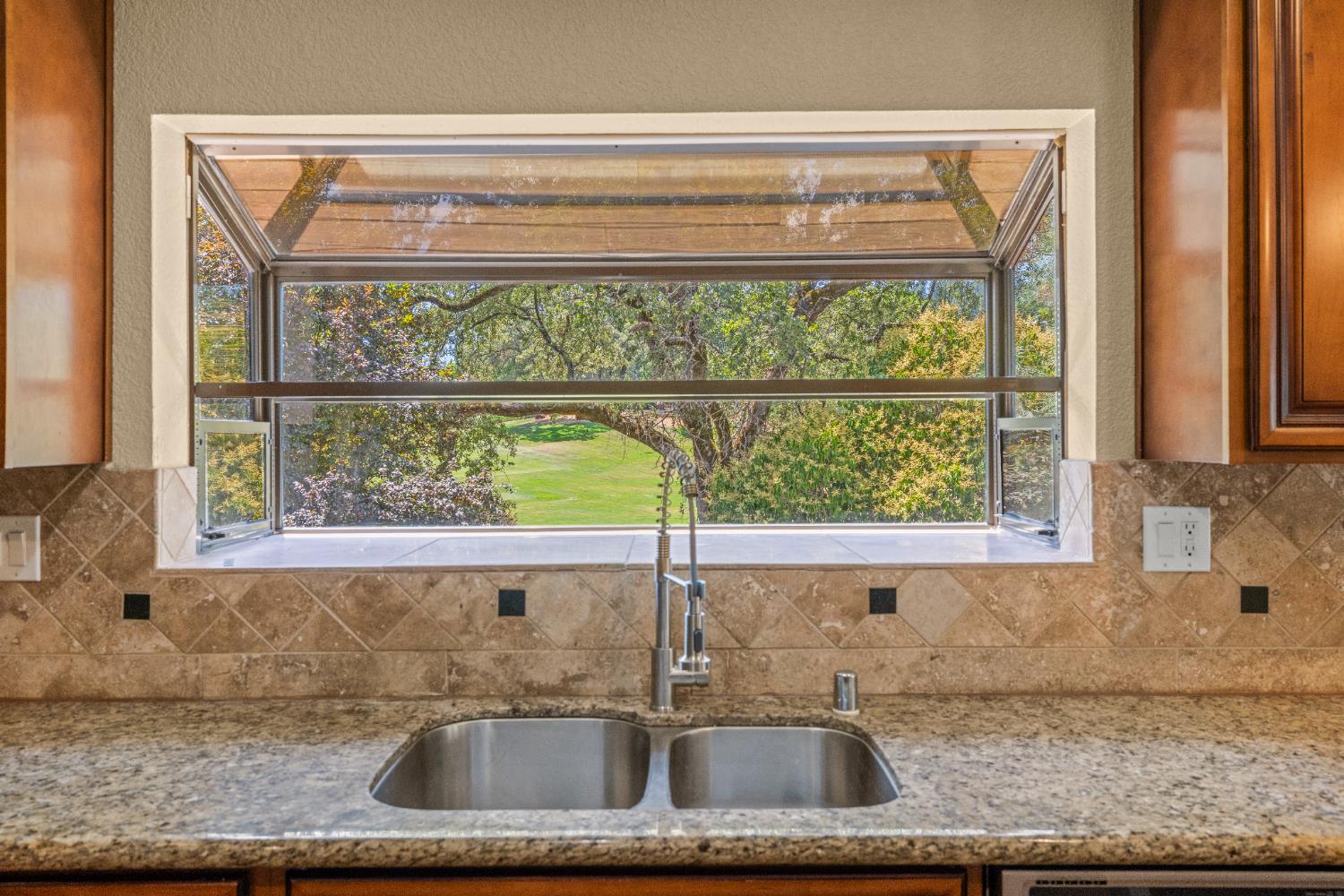 24126 Green Valley Road Auburn, CA 95602 - Photo 10 of 65 a kitchen sink sitting next to a window