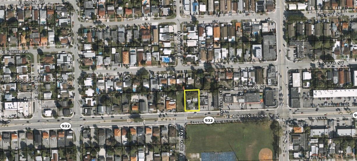 309 East 49th Street Hialeah, FL 33013 - Photo 2 of 2 a view of swimming pool next to a building with lake view