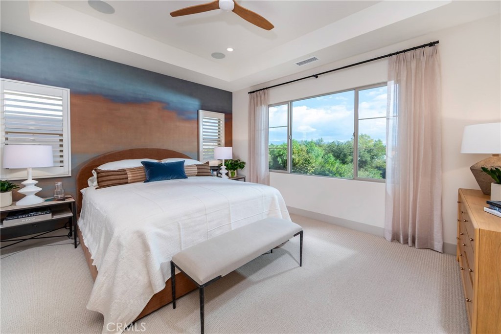 136 Pisano Irvine, CA 92618 - Photo 2 of 4 a bedroom with a large bed and a large window