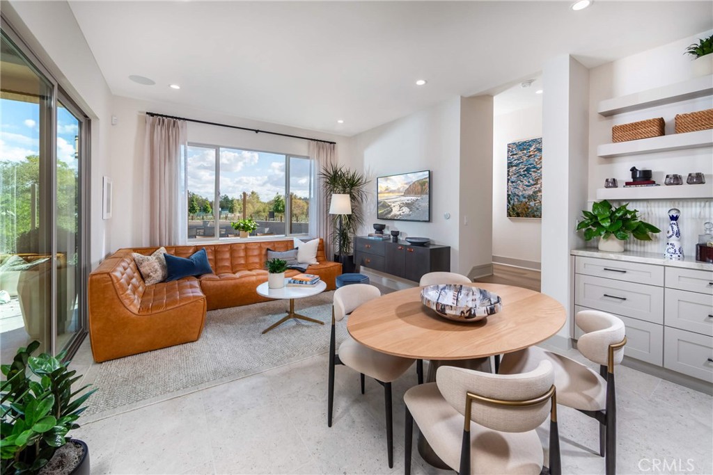 136 Pisano Irvine, CA 92618 - Photo 3 of 4 a living room with furniture and a large window