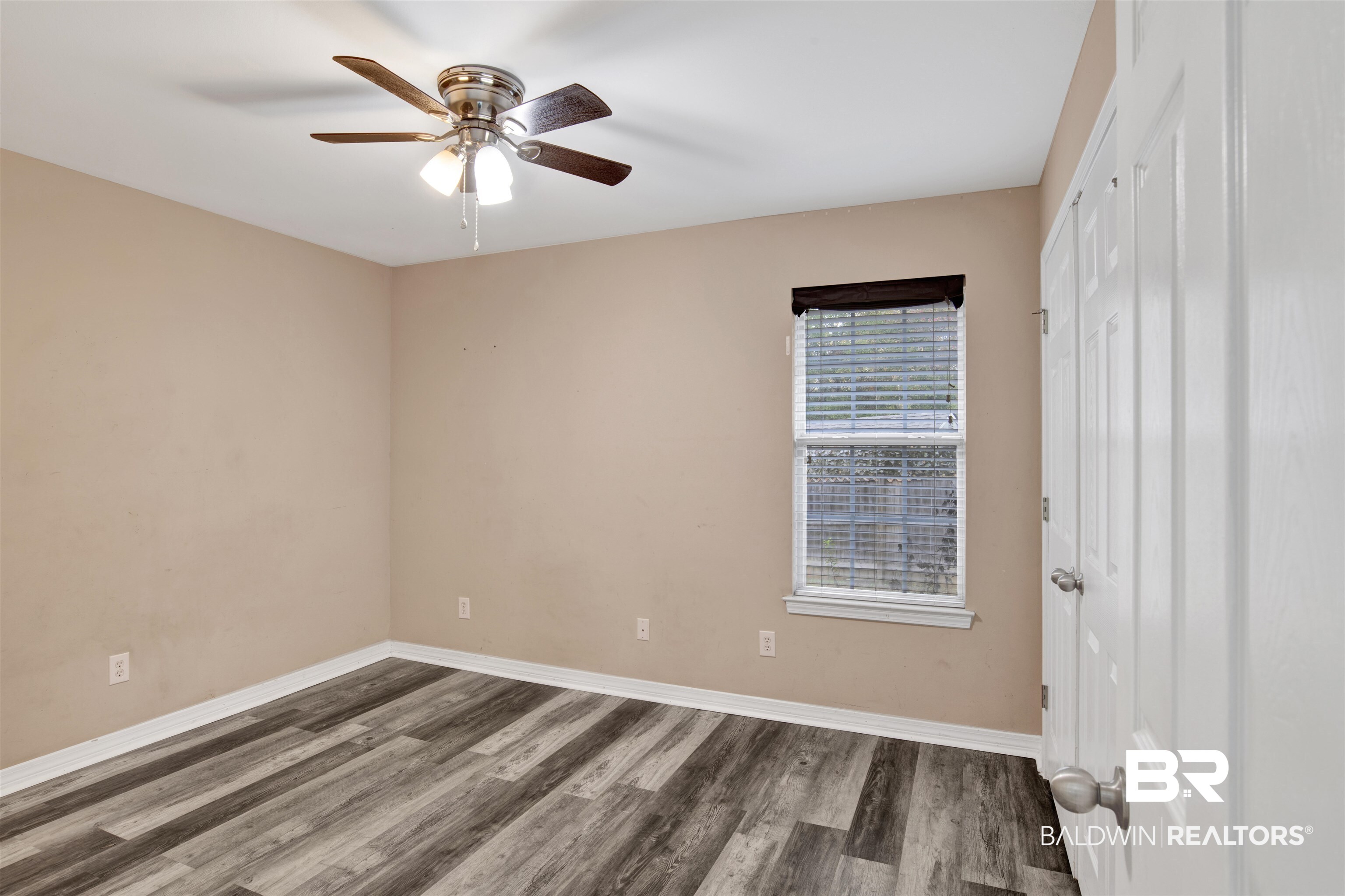 9534 Labrador Run North Mobile, AL 36695 - Photo 19 of 30 Unfurnished bedroom featuring wood finished floors, a closet, and ceiling fan