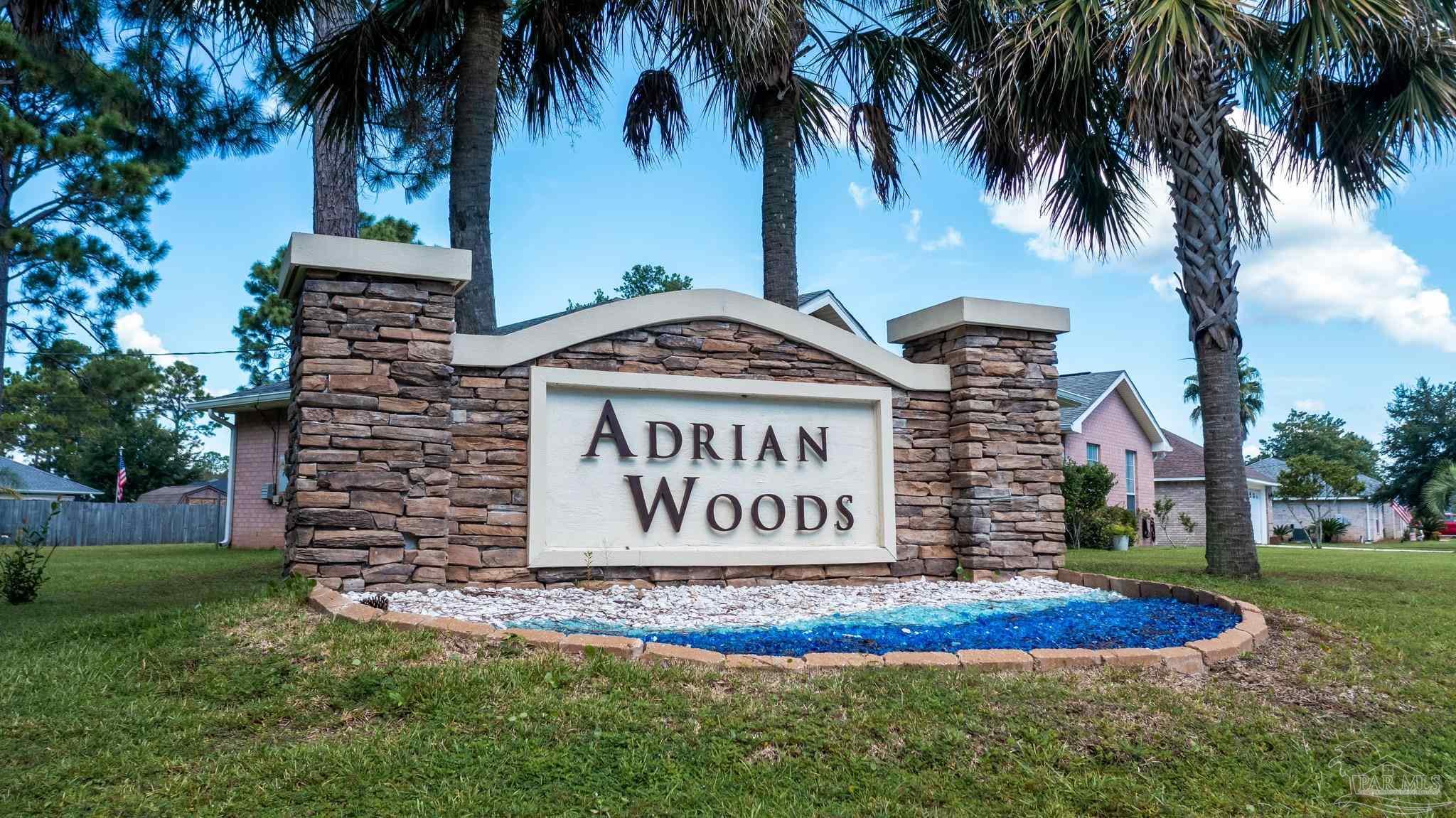 0 Adrian Way Milton, FL 32583 - Photo 2 of 8 a sign on the side of a building