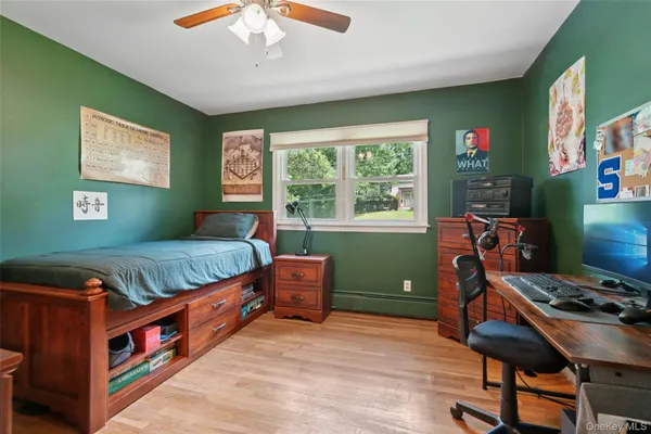 a bedroom with furniture and a window