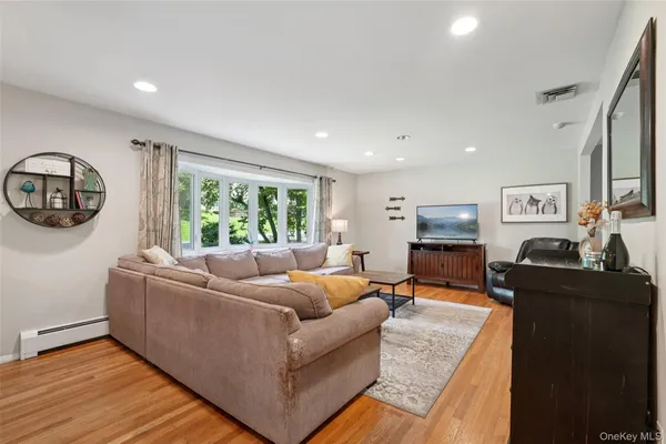 a living room with furniture and a large window