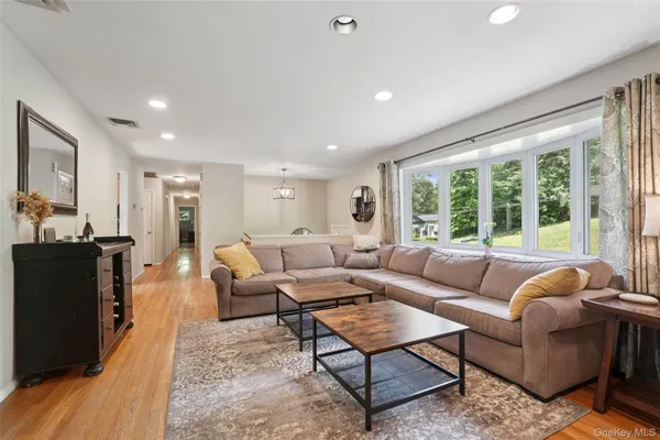 a living room with furniture and a large window