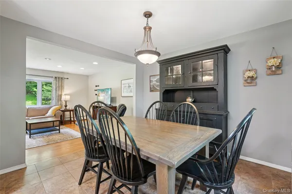 a view of a dining room with furniture window and outside view