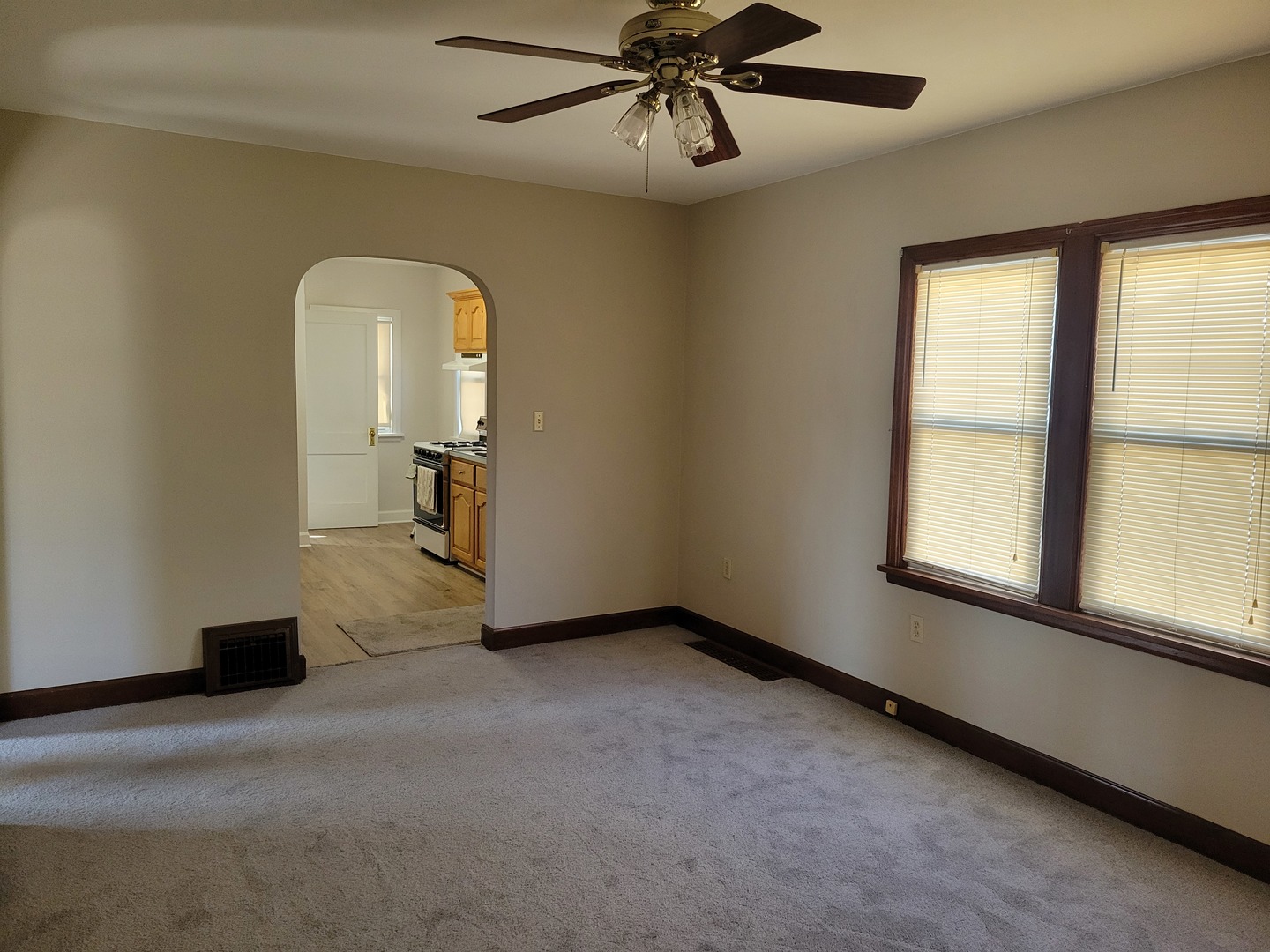 3607 26th Street Moline, IL 61265 - Photo 5 of 12 wooden floor in an empty room with a window