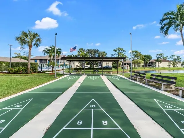 a view of a swimming pool and a yard