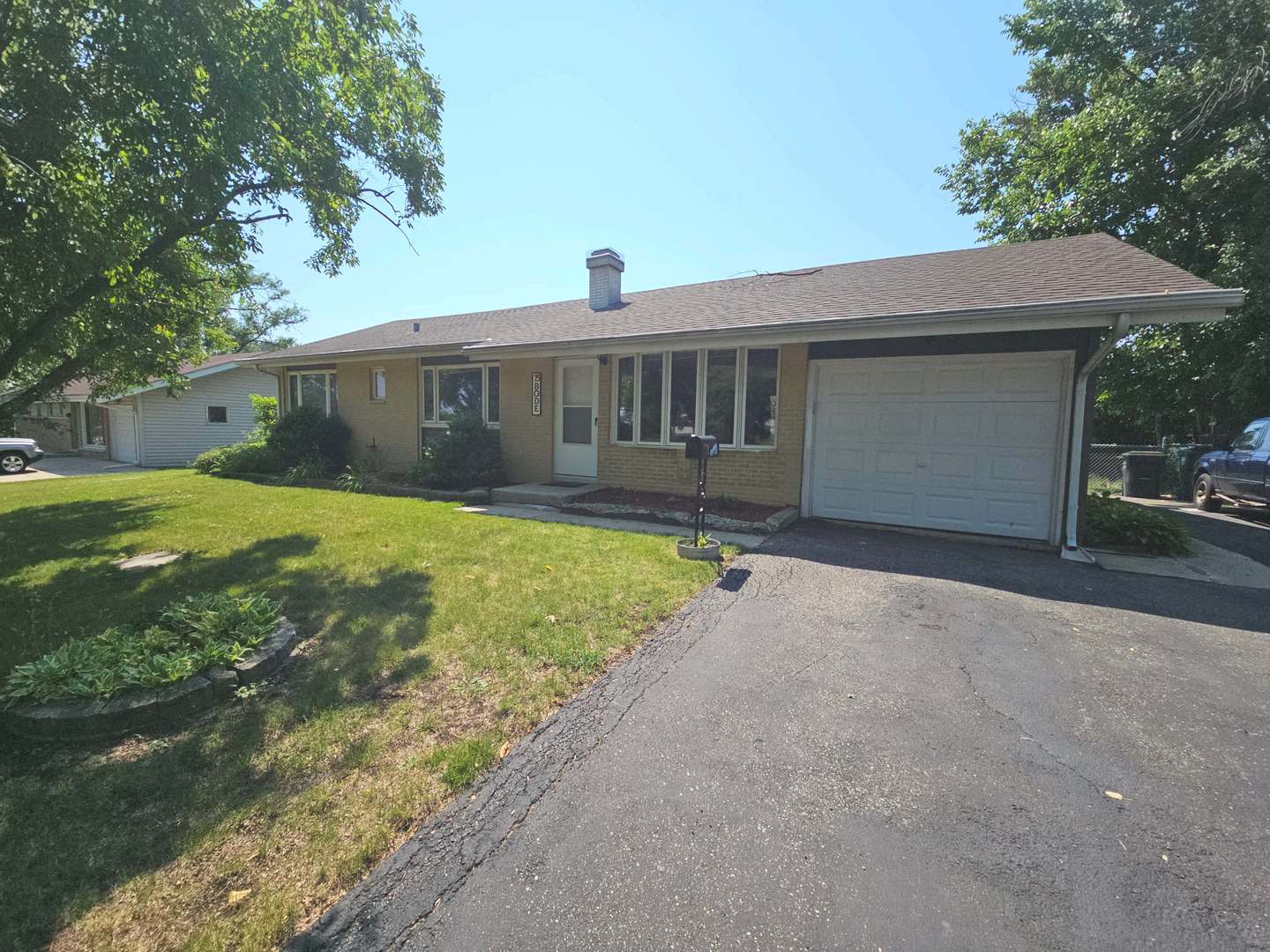 75 Bode Road Hoffman Estates, IL 60169 - Photo 1 of 19 a view of a house with backyard and a tree