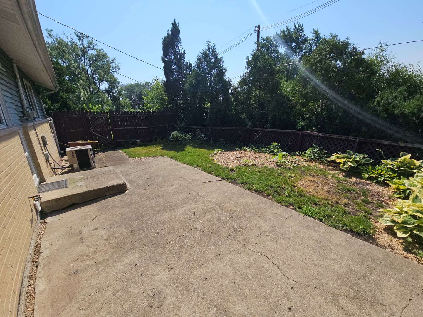 75 Bode Road Hoffman Estates, IL 60169 - Photo 11 of 19 a backyard of a house with lots of green space