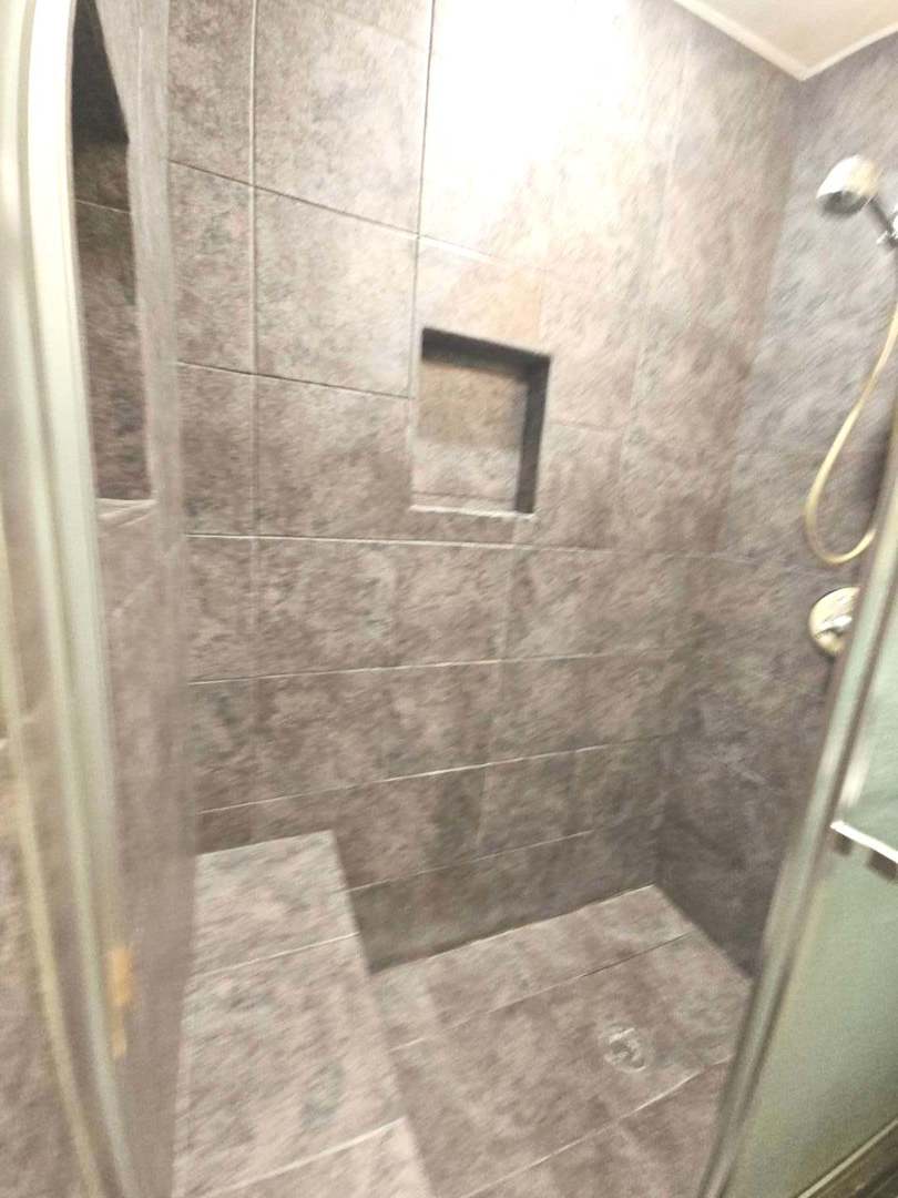 75 Bode Road Hoffman Estates, IL 60169 - Photo 17 of 19 a bathroom with a shower