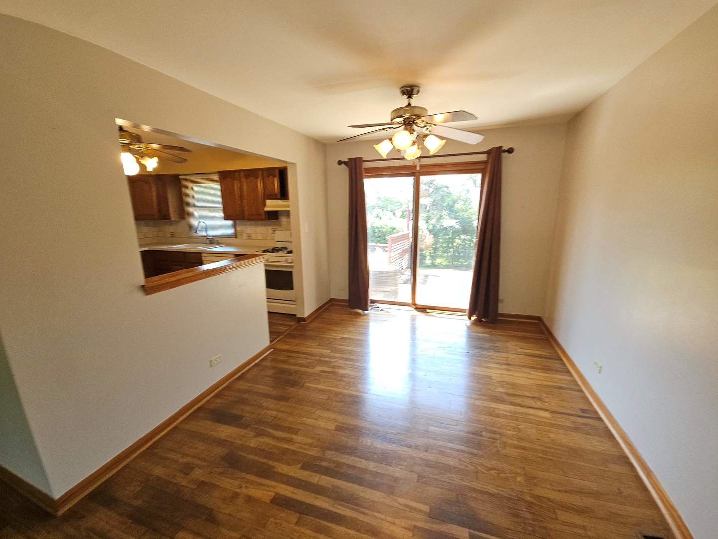 75 Bode Road Hoffman Estates, IL 60169 - Photo 8 of 19 wooden floor in an empty room with a window