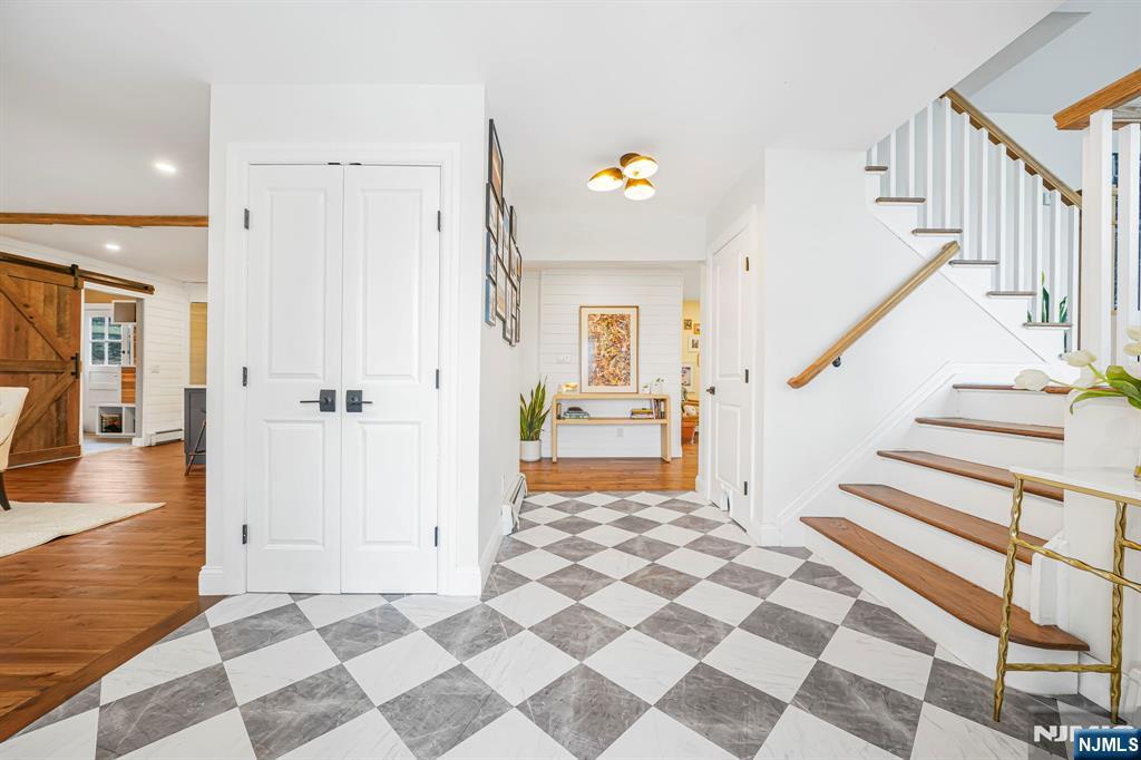 10 Winonah Avenue Wayne, NJ 07470 - Photo 12 of 41 a view of a hallway with wooden floor and a living room