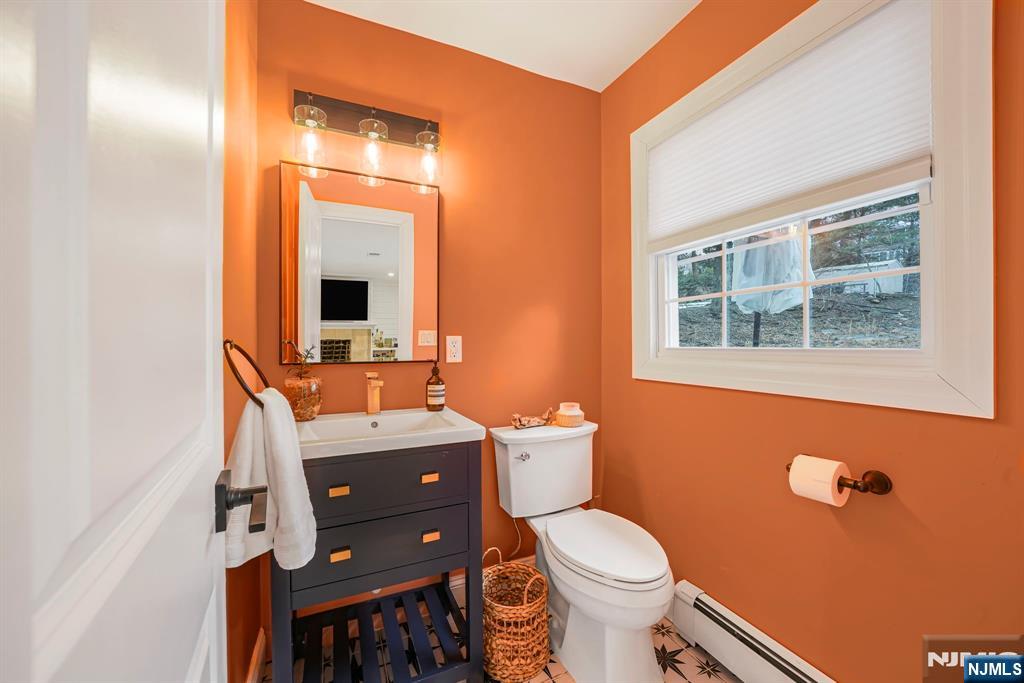 10 Winonah Avenue Wayne, NJ 07470 - Photo 17 of 41 a bathroom with a toilet a sink and a mirror