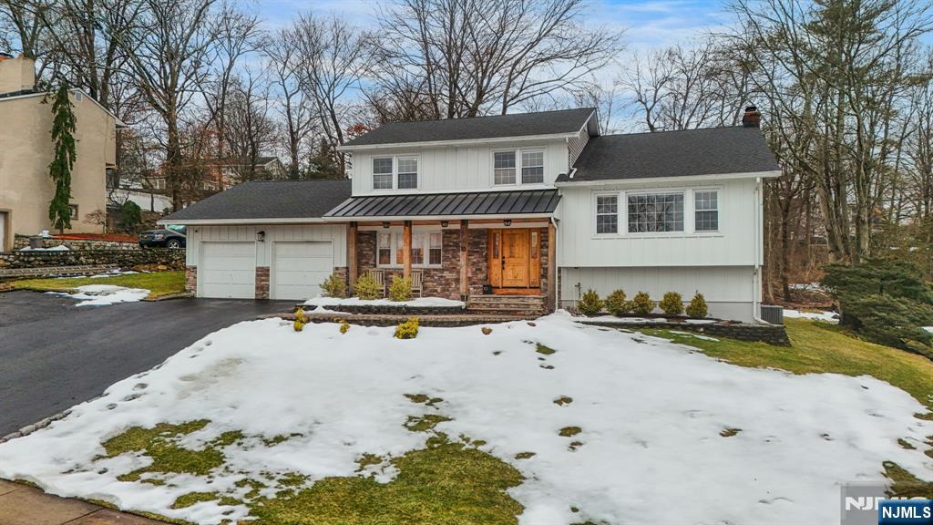 10 Winonah Avenue Wayne, NJ 07470 - Photo 2 of 41 a view of a white house with a swimming pool