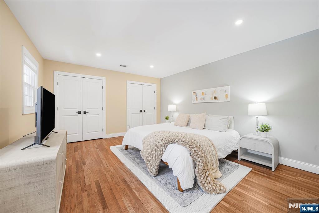 10 Winonah Avenue Wayne, NJ 07470 - Photo 21 of 41 a spacious bedroom with a bed and a flat screen tv