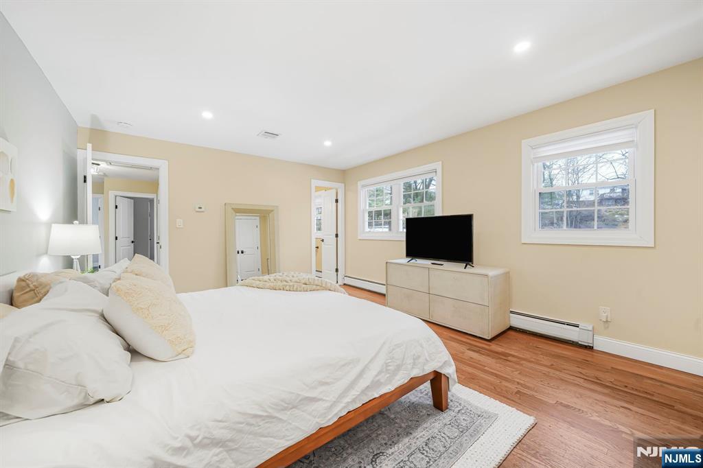 10 Winonah Avenue Wayne, NJ 07470 - Photo 22 of 41 a bedroom with a bed and a flat screen tv