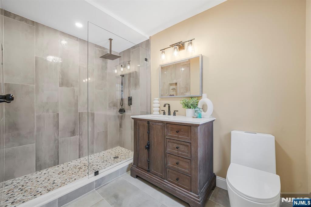 10 Winonah Avenue Wayne, NJ 07470 - Photo 23 of 41 a bathroom with a sink toilet a shower and a mirror