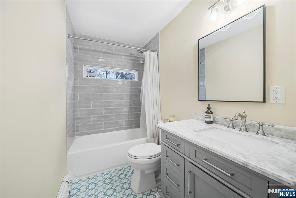 10 Winonah Avenue Wayne, NJ 07470 - Photo 24 of 41 a bathroom with a granite countertop sink a toilet and shower