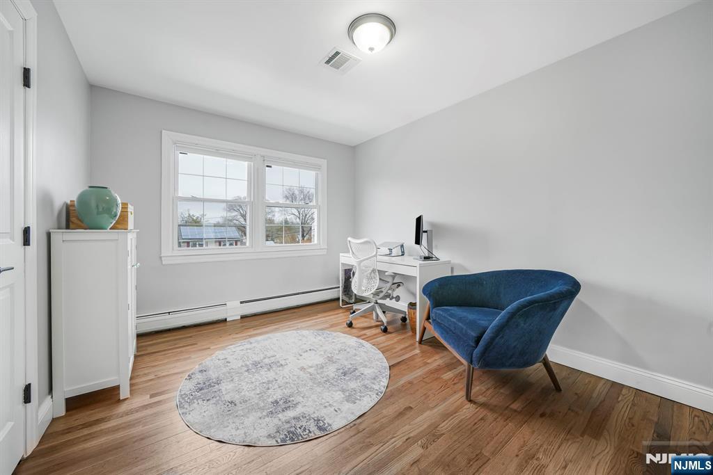 10 Winonah Avenue Wayne, NJ 07470 - Photo 26 of 41 a living room with furniture and a wooden floor